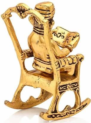Golden Lord Ganesha on Rocking Chair Reading Ramayan – 17 cm